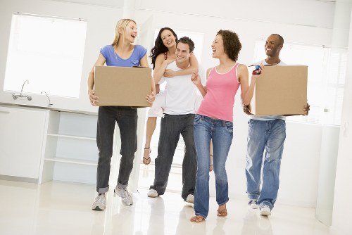 Professional packing team preparing household items for a London move
