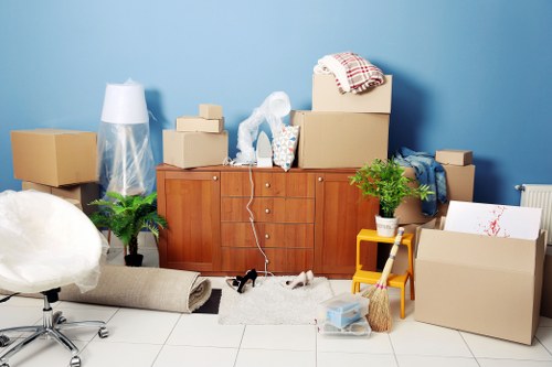 Removal team handling boxes and furniture for a local house move