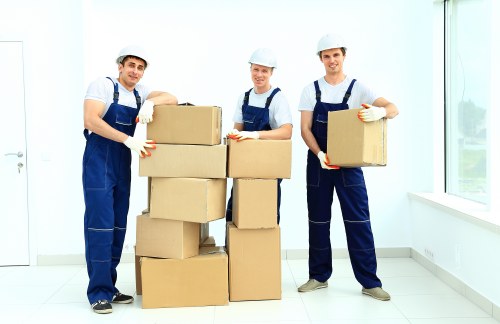 Removal team planning a London house move with boxes and furniture