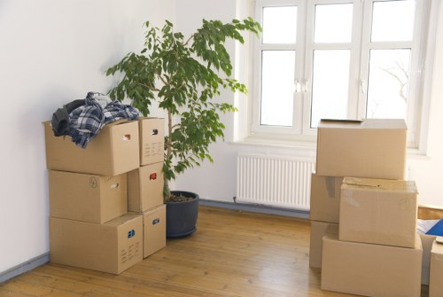 Removal van loading boxes and furniture in a London street