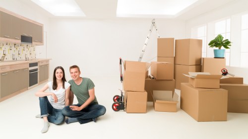 Urban house removals team working with coordinated logistics