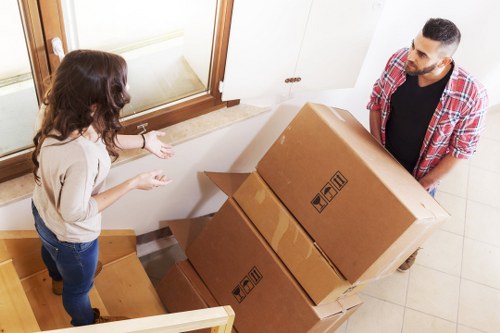 Movers loading protected furniture for a local relocation