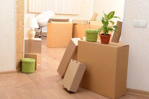 Packed boxes and furniture ready for a man and van removal service