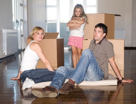 Loading furniture into a removal van on a London street